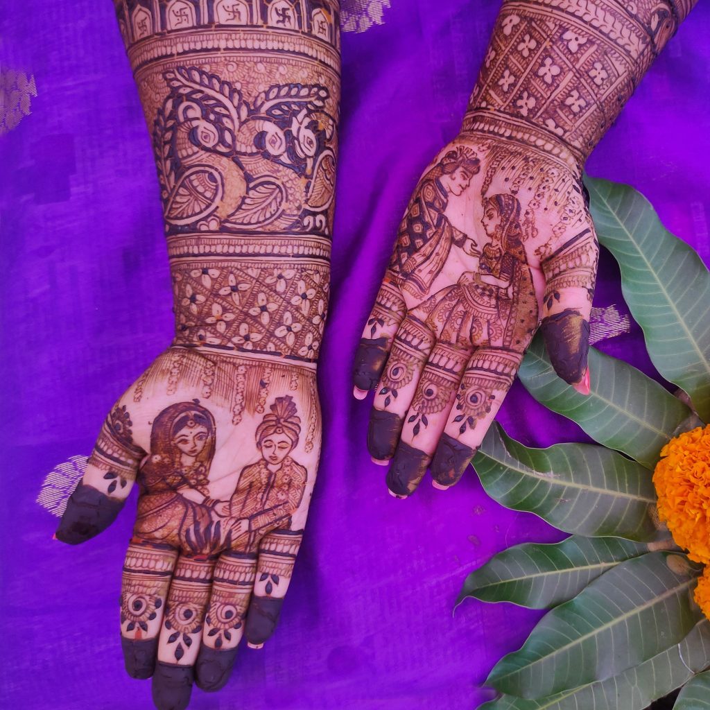 Indian Bride Showing Simple Mehndi Design With Bride & Groom